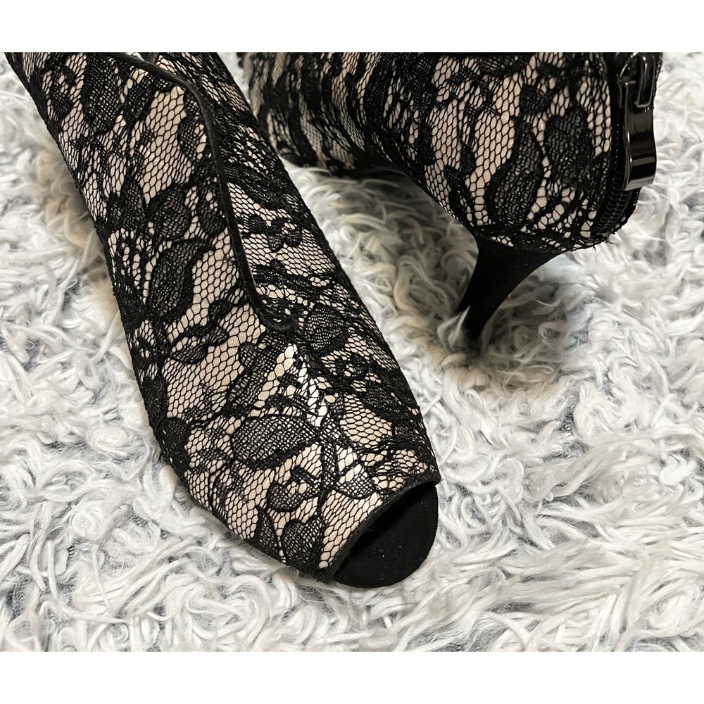 Sexy and sassy, lace floral details, peep toe, zips in back, undertone.
